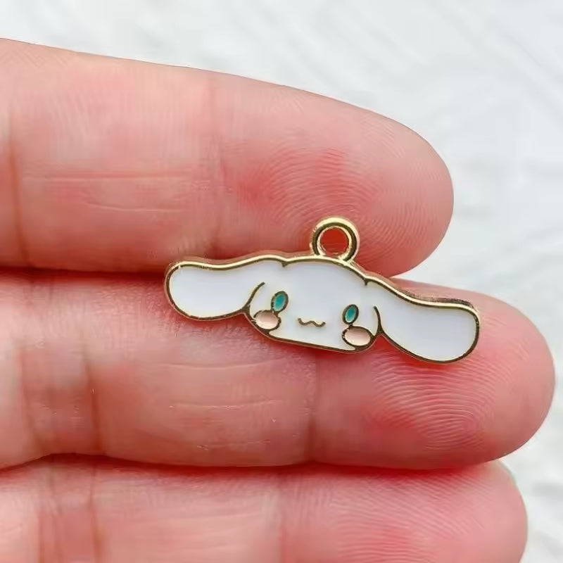 Dije Sanrio Metlálicos 4 Pack 50%Desc