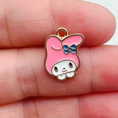 Dije Sanrio Metlálicos 4 Pack 50%Desc